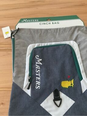 Masters NWT Gray and Green Cinch Backpack yellow Logo Patch, zippered pockets
